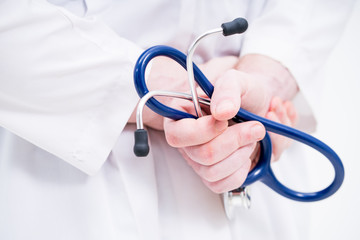 close up doctor hand holding stethoscope