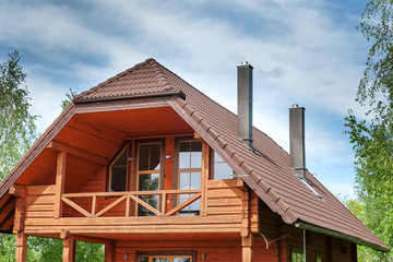 Upper part of wooden cottage.