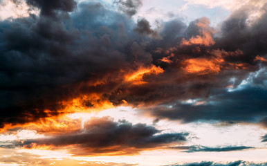 Obraz premium Dramatic gray, blue and orange sunset on beautiful sky, free space. Sky background on sunset with clouds