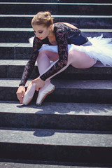 Fototapeta na wymiar Young sweet fairy ballerina Inspires people and shows the beauty of body movement