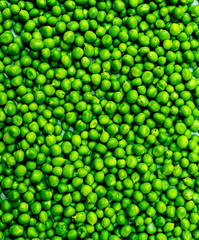 Fresh green peas vegetable texture background, top view, free space