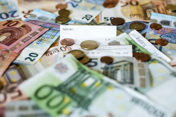 savings Cash money concept euro banknotes all sizes and cent coins on desk bill pay store text sum total save