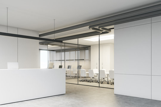 White office with a reception desk corner