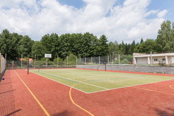 Outdoor playground for tennis, volleyball and football.