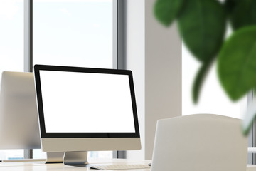 Blank computer screen in office