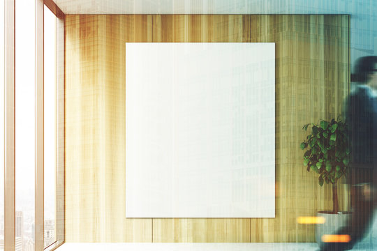 Blank poster in a wooden office, people