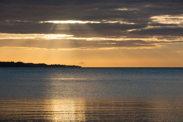 Beautiful sunrise in the summer by the quiet sea