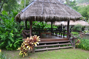 Fototapeta na wymiar Wooden gazebo for relaxing. Thailand