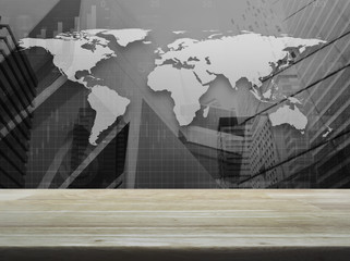 Fototapeta na wymiar Empty brown wooden table top over black and white world map with financial graph and city tower, Elements of this image furnished by NASA