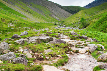 Fototapeta na wymiar Lake District National Park, path to Scafell Pike, view of the mountains, stream, England, selective focus
