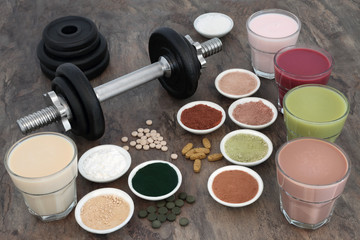 Weight training equipment for body builders with dumbbell weights, dietary food supplements and...