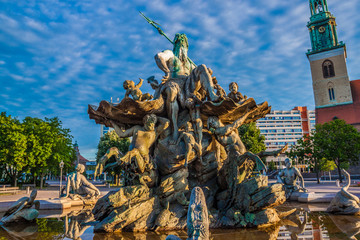 The Neptune Fountain in Berlin at sunrise, Germany