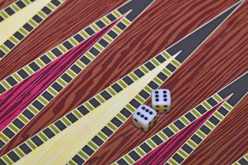 Dice on the board of backgammon game