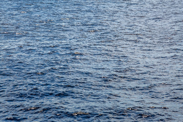 The water surface of the river, sea, lake or ocean. Textured background.