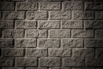Grunge background. Gray concrete wall with masonry imitation.