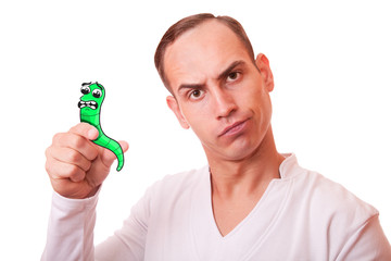 portrait of a young man in white background c cartoon scared worm in the hand