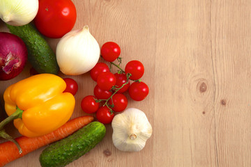 Pile of organic vegetables on a wooden table
