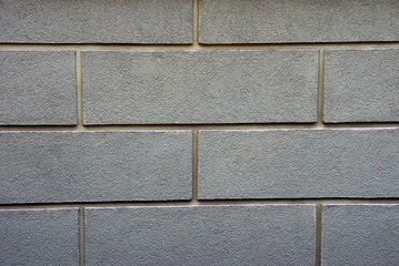 каменная текстура из серой кирпичной стены дома 