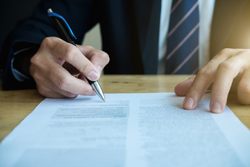 Close up business man reaching out sheet with contract agreement proposing to sign.Full and...