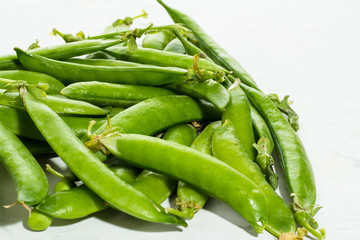Green peas on a white background.