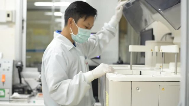 Asia scientist working in laboratory.