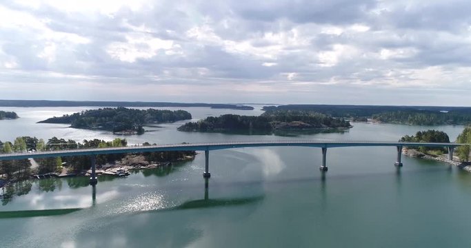 Lovon silta, Cinema 4k aerial view away from the lovo bridge connecting kemionsaari and kasnas, in the finnish archipelago, in Varsinais-suomi, Finland