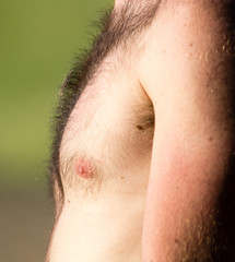 Fototapeta premium Hairy chest of a man in the open air