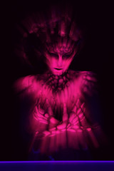 Freak girl in ultraviolet costume 