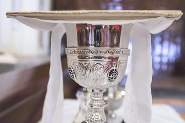Chalice displayed over table at church