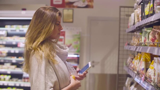 Young attractive woman in a supermarket