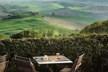 view from the restaurant on the Tuscan field at sunset.