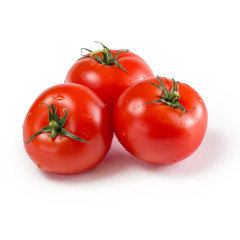 Red fresh tomatoes on a white isolated background