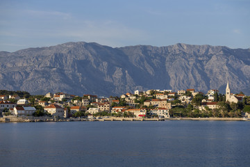 Picturesque village Sumartin on south-east of Brac island in Croatia, on the background Biokovo mountain