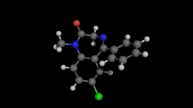 Diazepam (Valium) ball and stick molecule model rotating. Diazepam,marketed as Valium,is a medication producing a calming effect,