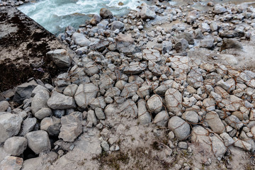 White stone ground wrapped with iron wire mesh for safety at Thangu and Chopta valley in winter in Lachen. North Sikkim, India.