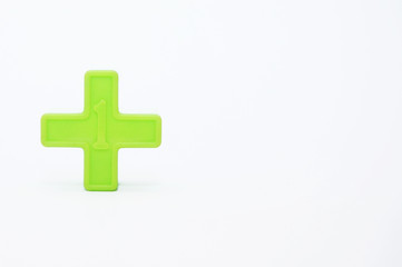 Fototapeta premium Toddlers Toys With Number 1 Sign Over White Background