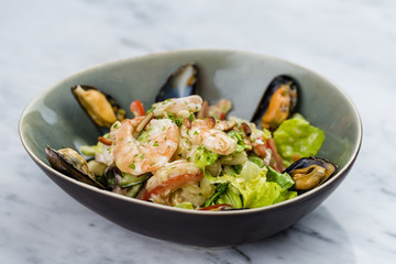 Seafood salad with shrimps, calamari and mussels