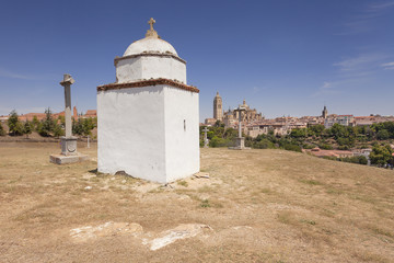 Cemetery in medieval Spanish town with cathedral in the background 