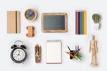 Back to school concept with school supplies organized on white background. Top view