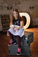 Little girl in loft studio