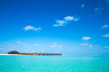 Obraz na płótnie Canvas beach with water bungalows at Maldives