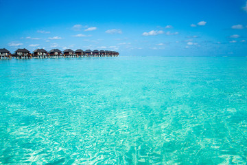 Plakat beach with water bungalows at Maldives