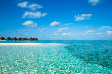 beach with water bungalows at Maldives