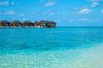 beach with water bungalows at Maldives