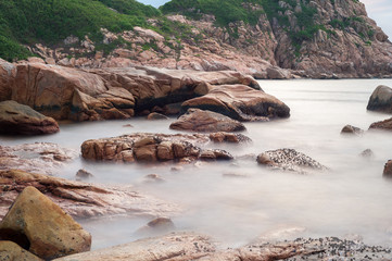 Long exposure photography of rocky coastline