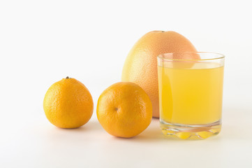 Citrus fruit and juice on isolated background