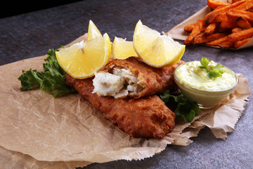traditional British fish and chips on brown paper