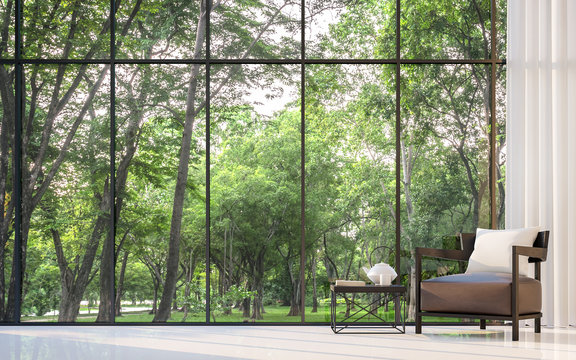 Fototapeta Modern living room with garden view 3d rendering Image.There are large window overlooking the surrounding garden and nature