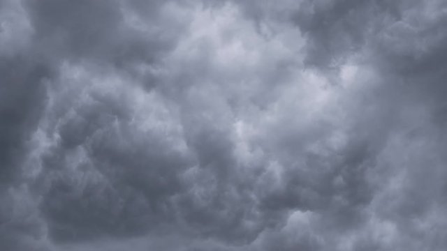 Time lapse Nature background Ominous clouds drift slowly across the sky, threatening rain. UltraHD stock footage.