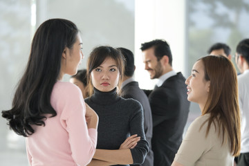 Fototapeta premium Asian women takling together at office place, women working concept.